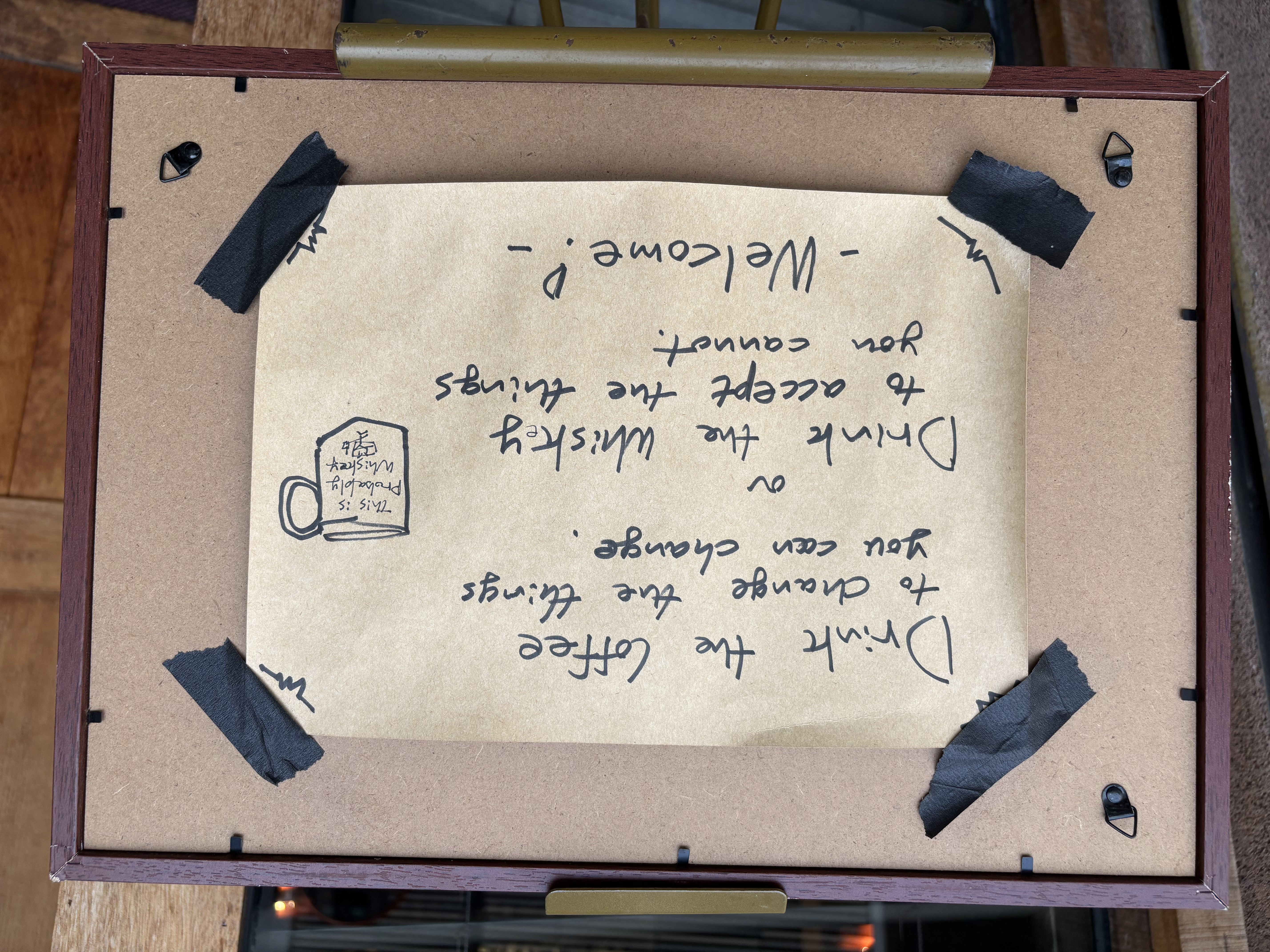 Handwritten cafe sign: drink the coffee to change the things you can change, or drink the whiskey to accept the things you cannot, Seoul